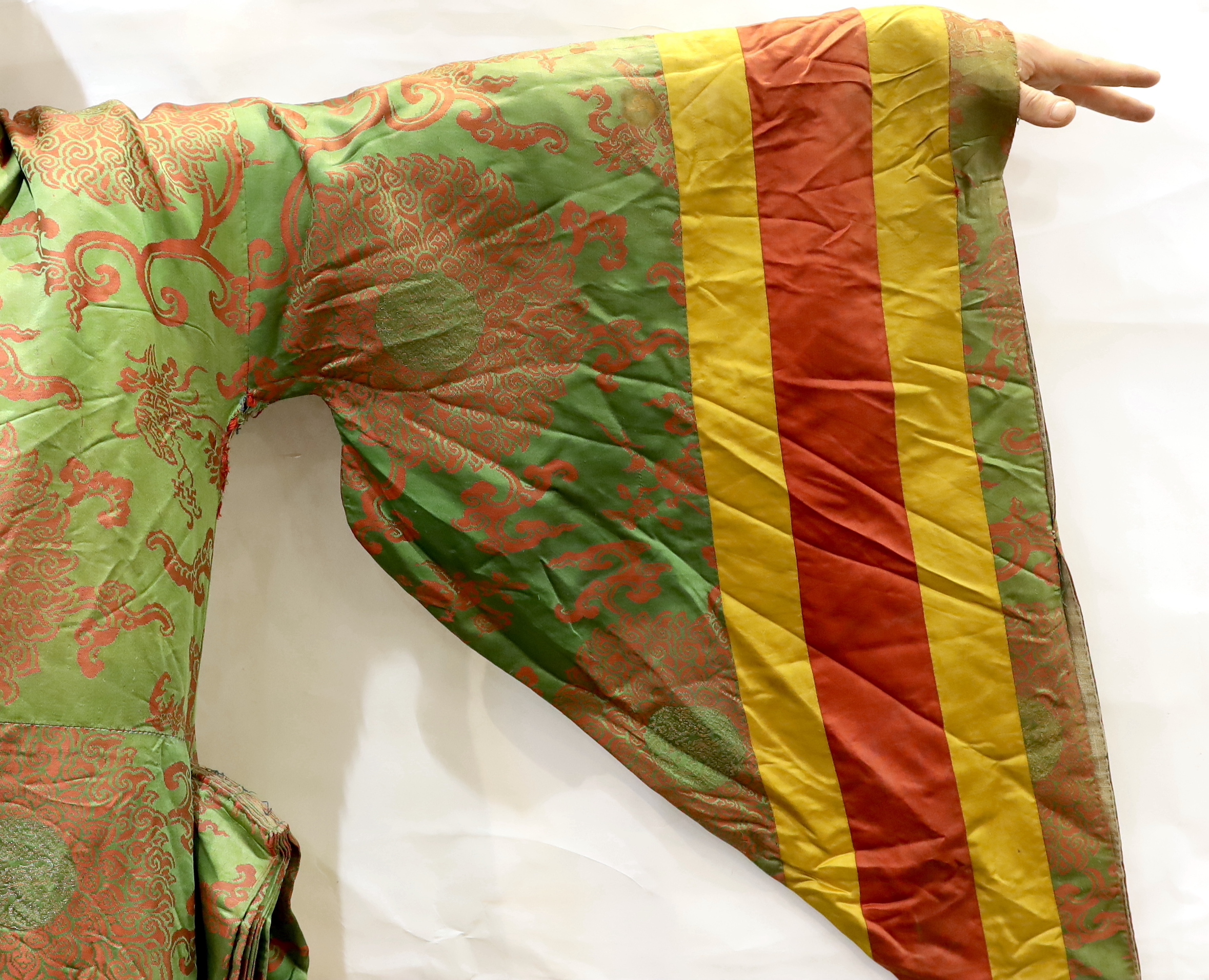 An unusual early 20th century Japanese silk damask kimono, designed with pointed sleeves and wide pleating on the hips, and horizontal yellow and red stripes, possibly a costume for a Kabuki theatre character